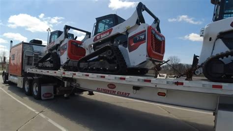 skid steer on flatbed truck|mini on flatbed truck.